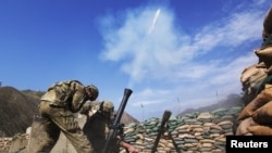 U.S. soldiers fire a mortar rounds at suspected insurgent positions in the Pech River valley in Kunar Province (file photo).