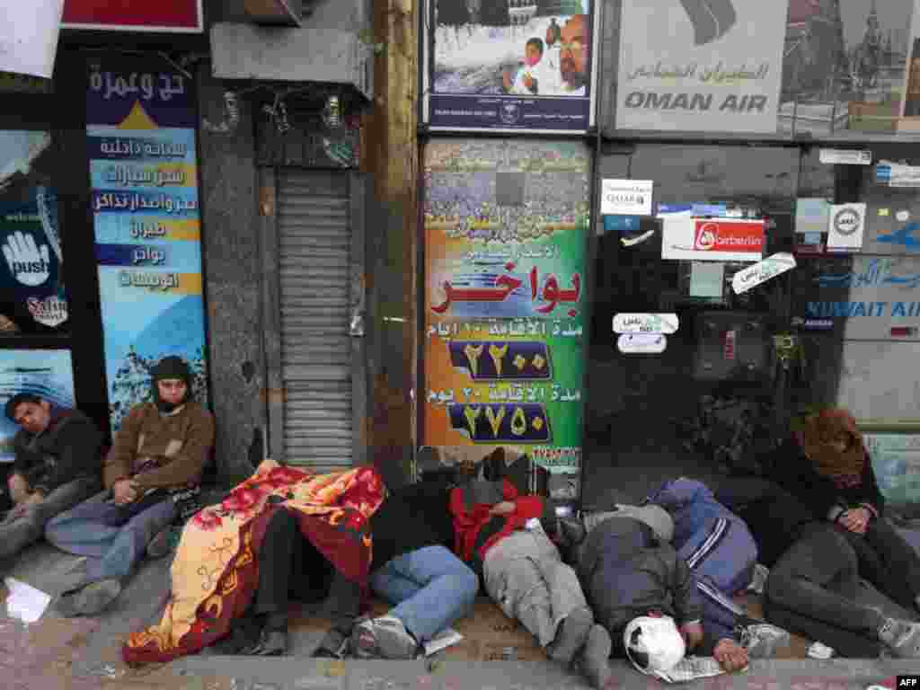 Antigovernment demonstrators sleep on Tahrir Square.