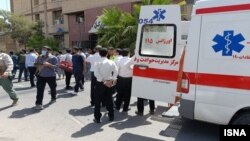 Iranian emergency workers attend the aftermath of a deadly attack on a courthouse in the southeastern city of Zahedan on July 26. 