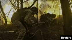 Ukrainian soldiers fire a field artillery gun toward Russian troops at a frontline position in the Zaporizhzhya region on March 31.