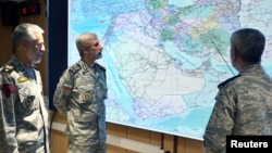 Iranian Army commander-in-chief Amir Hatami (center) attends a meeting in the military's War Command Room at an undisclosed location in Iran.