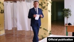 Alan Gagloyev casts his ballot on April 10.