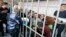 Former prison guards of the Correctional Colony No. 1 in Yaroslavl attend a court hearing in Yaroslavl on February 21.