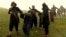 A screenshot from the IS video, showing prisoners being led to their deaths. 