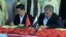 Chairman of Pakistan's Gwadar Port Authority Dostain Khan Jamaldini (R) and chairman of China Overseas Port Holding Company (COPHC), Zhan Baozhang (L) sign a document during a ceremony in the Gwadar in November.