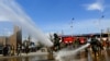 Afghan National Army (ANA) soldiers spray disinfectant in the eastern city of Jalalabad to prevent the spread of the coronavirus disease (COVID-19) on April 9.
