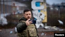 Ukraine's President Zelenskyy appears in the frontline town of Kupyansk on December 12.