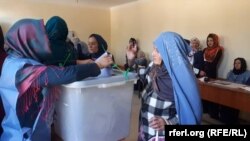 FILE: Afghan women voting during a parliamentary election in October 2018.