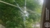 Armenia - A bullet hole on a window of a house in the border village of Khoznavar, May 29, 2025.