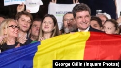 Romanian presidential candidate Nicusor Dan celebrates after exit polls showed him winning a runoff vote. Official results confirmed the victory.