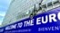 Плякат «Баўгарыя, вітаем у эўразоне!» побач з Эўрапейскай камісіяй у Брусэлі