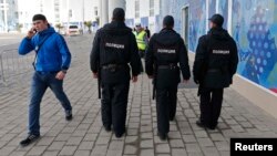 Security guards patrol near the Olympic Park ahead of the Sochi games next month. 