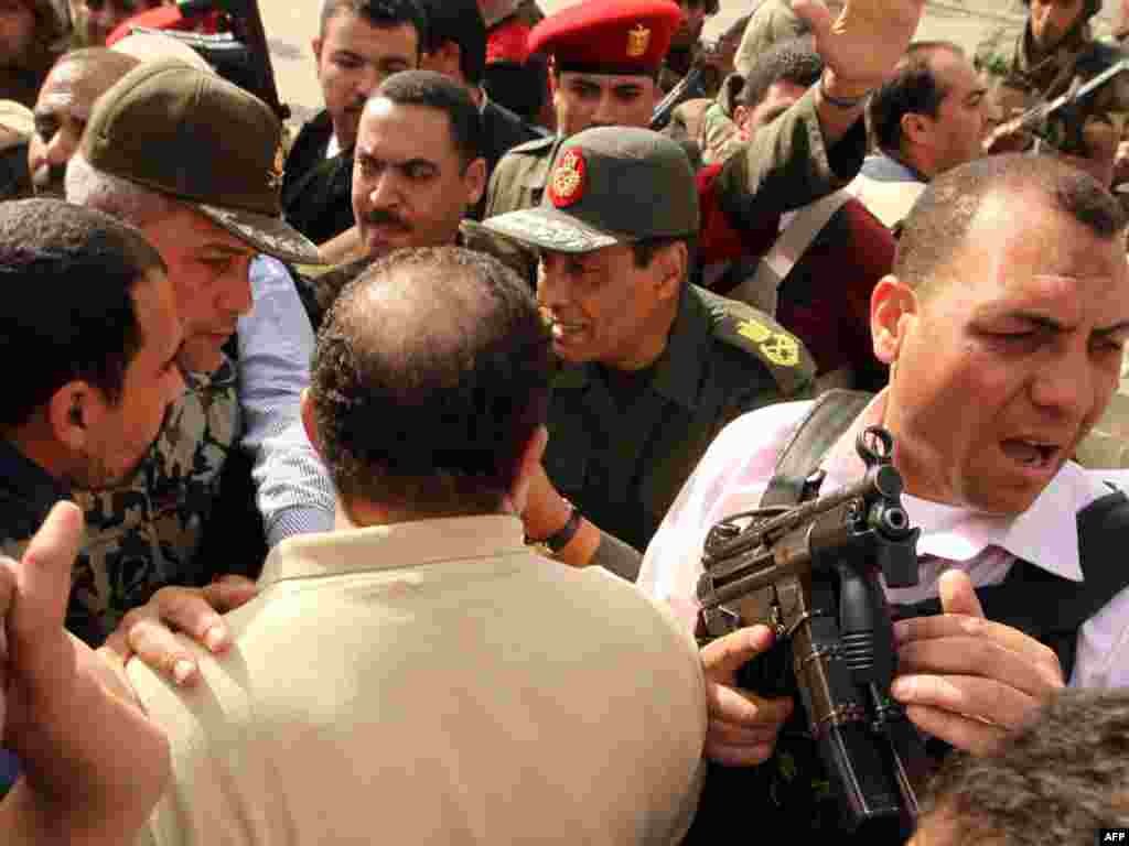 Defense Minister Mohammed Hussein Tantawi talks to antigovernment protesters in Tahrir Square.