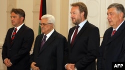 Palestinian President Mahmud Abbas (second from left) is welcomed by members of the Bosnian Presidency, Zeljko Komsic (left), Bakir Izetbegovic (second from right), and Nebojsa Radmanovic (right) upon his arrival for bilateral talks in Sarajevo earlier th