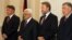 Palestinian President Mahmud Abbas (second from left) is welcomed by members of the Bosnian Presidency, Zeljko Komsic (left), Bakir Izetbegovic (second from right), and Nebojsa Radmanovic (right) upon his arrival for bilateral talks in Sarajevo earlier th