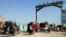 Afghans flee their villages after the fighting intensified between Taliban militants and security forces in Lashkar Gah, the provincial capital of restive Helmand Province, on October 12.