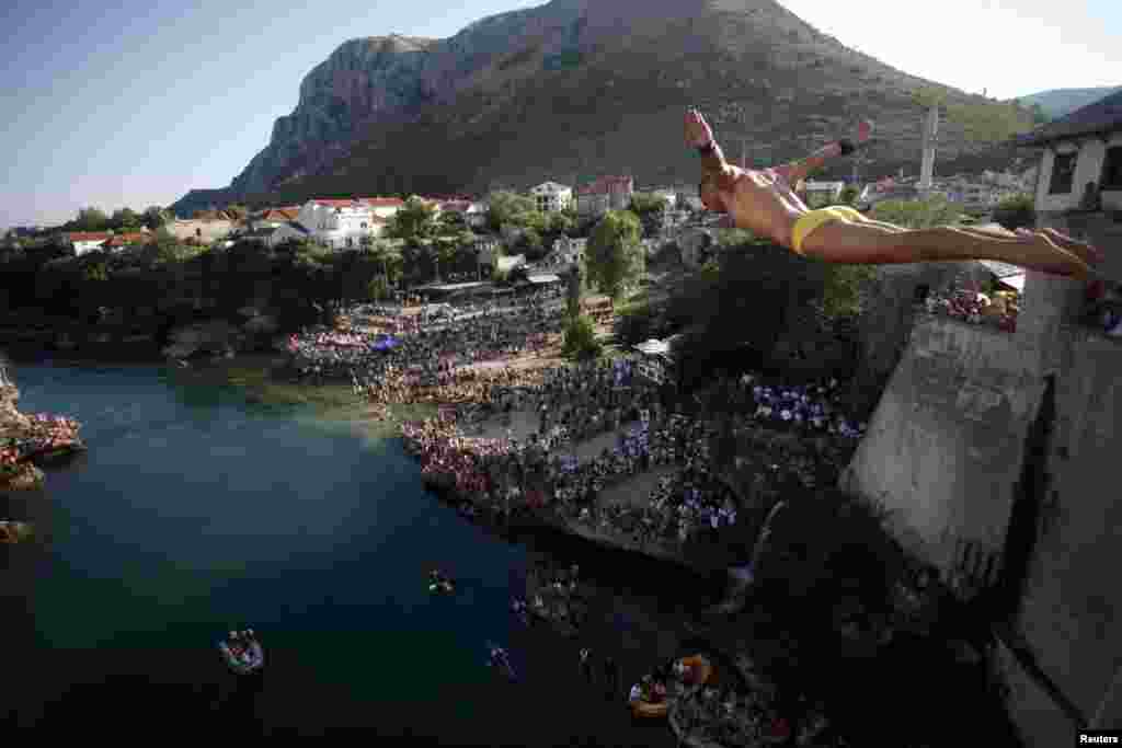 Diver Lorens Listo jumps from the center of Mostar's Stari Most, or Old Bridge. Diving competitions have been held here since the bridge was built 447 years ago, although the current formal competition dates back only to 1968.