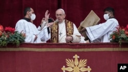 Pope Francis delivers his Urbi et Orbi ("to the city and to the world") Christmas message from the main balcony of St. Peter's Basilica at the Vatican on December 25. 