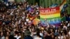 People attend a gay pride parade in Budapest in July 2021. The LGBT community and other critics say the government stigmatizes sexual minorities and stifles discourse on sexual orientation.
