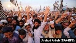 Supporters of Islamic political party Jamiat Ulma-e-Islam shout slogans at a rally in Peshawar on September 7 to mark the anniversary of the Pakistani parliament's 1974 bill deeming Ahmadis "non-Muslims."