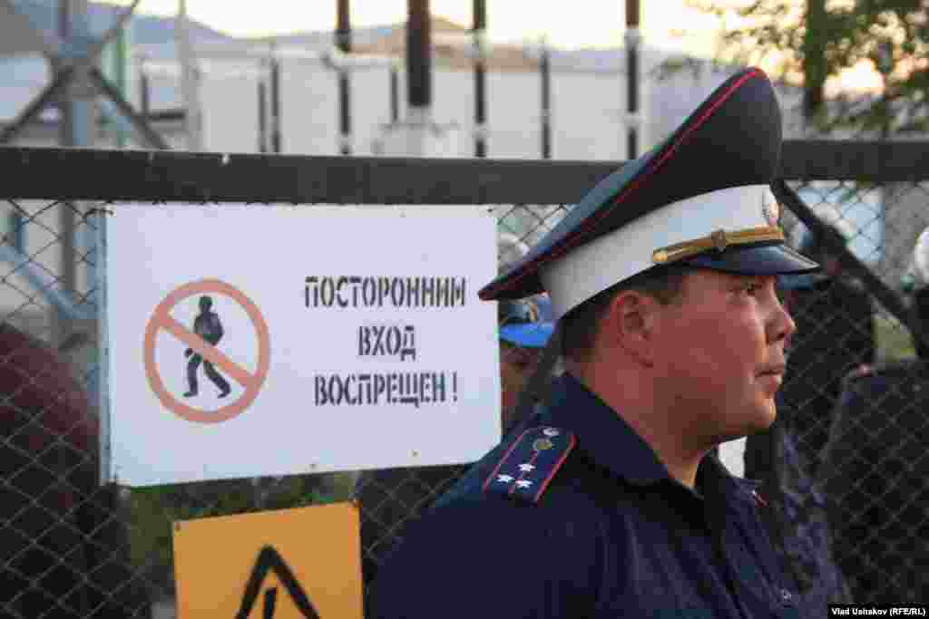 A policeman guards a gate that leads to the Kumtor gold mine.