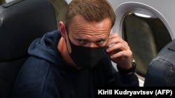 Russian opposition leader Aleksei Navalny is seen in a Pobeda plane after it landed at Moscow's Sheremetyevo airport on January 17.