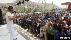 Thousands of Kabul residents, relieved at the end of lockdown measures, have been flocking to City Park, which features an amusement park and hosts concerts. (file photo) 