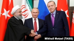 Iranian President Hassan Rohani with Russian President Vladimir Putin and Turkish President Recep Tayyip Erdogan at talks on Syria in Sochi in November
