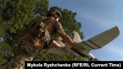A Ukrainian soldier launches a Furia fixed-wing reconnaissance drone on September 9.