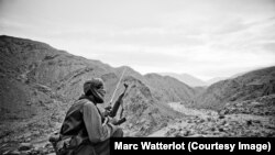 A Baluch separatist guerrilla keeps watch.