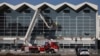 A rescue team inspects the area on November 2 where part of the roof of a railway station collapsed in Novi Sad the day before. 