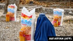 د یوې بیوزلې افغانې مېرمنې عکس