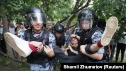 Police detain a participant at a rally in support of Russian investigative journalist Ivan Golunov in Moscow on June 12.